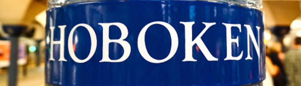 a hoboken, nj, sign at the station